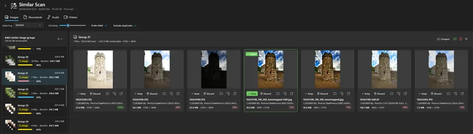 The Images tab showing group 21: seven versions of the same stone tower at
                    different exposures, scored 100%, 84%, 66%, 80% and 72%, with one marked Keeper.